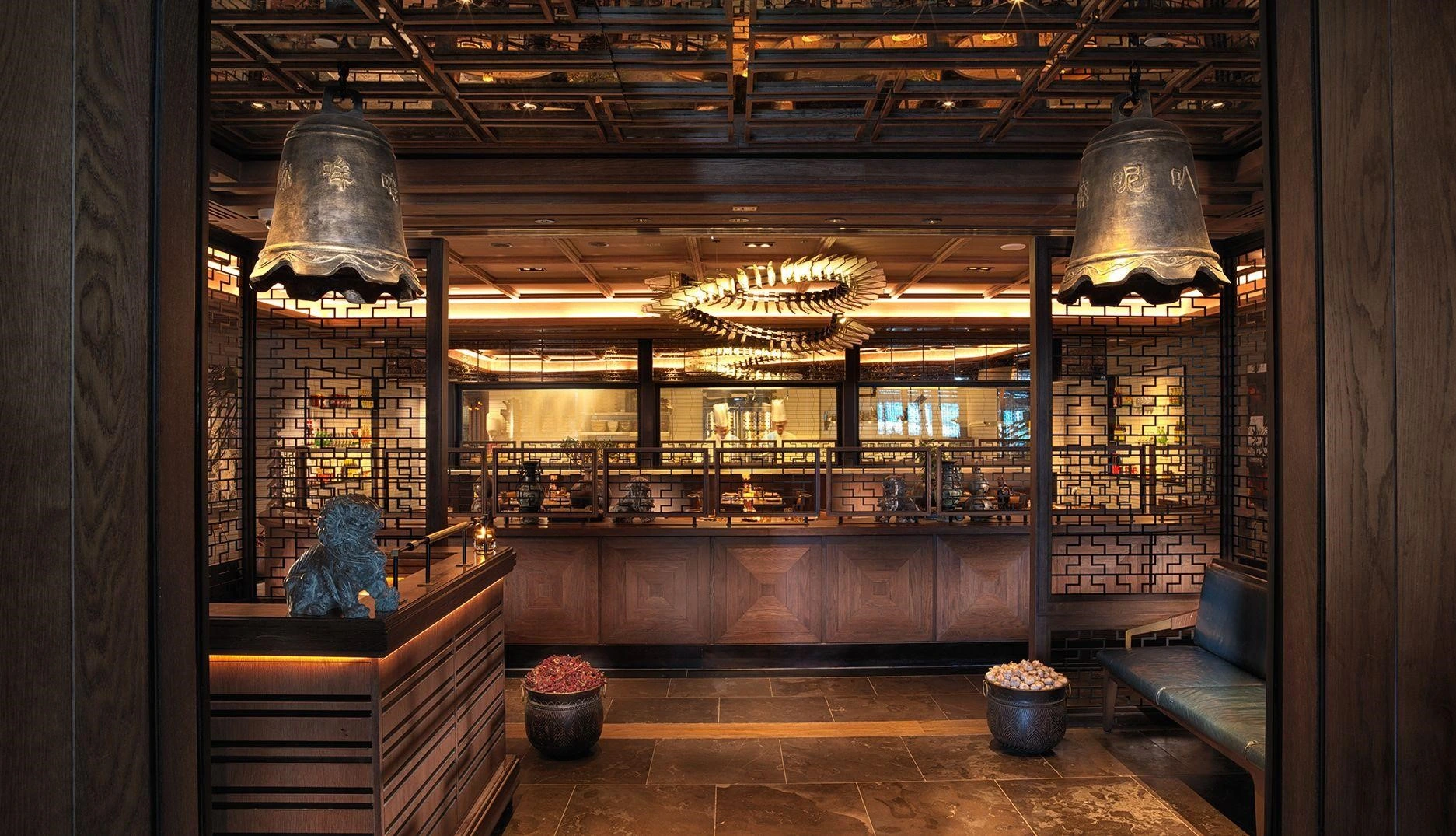 Elegant Chinese restaurant with traditional decor, wooden panels, and ambient lighting