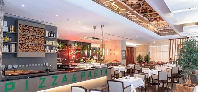 Italian bistro with cozy interior, white table settings, and warm lighting