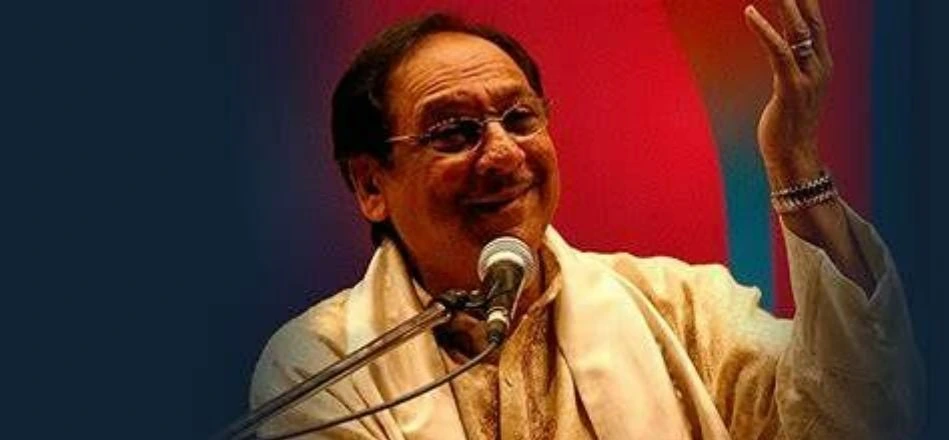 Singer Ghulam Ali performing live on stage, passionately delivering soulful music for his audience