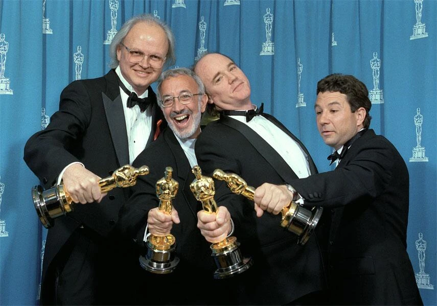 Jurassic Park (1993) team with Oscar awards for Best Sound and Visual Effects.
