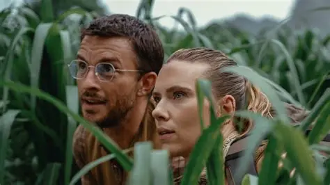 Jurassic Park rebirth poster featuring the main cast in a jungle setting.