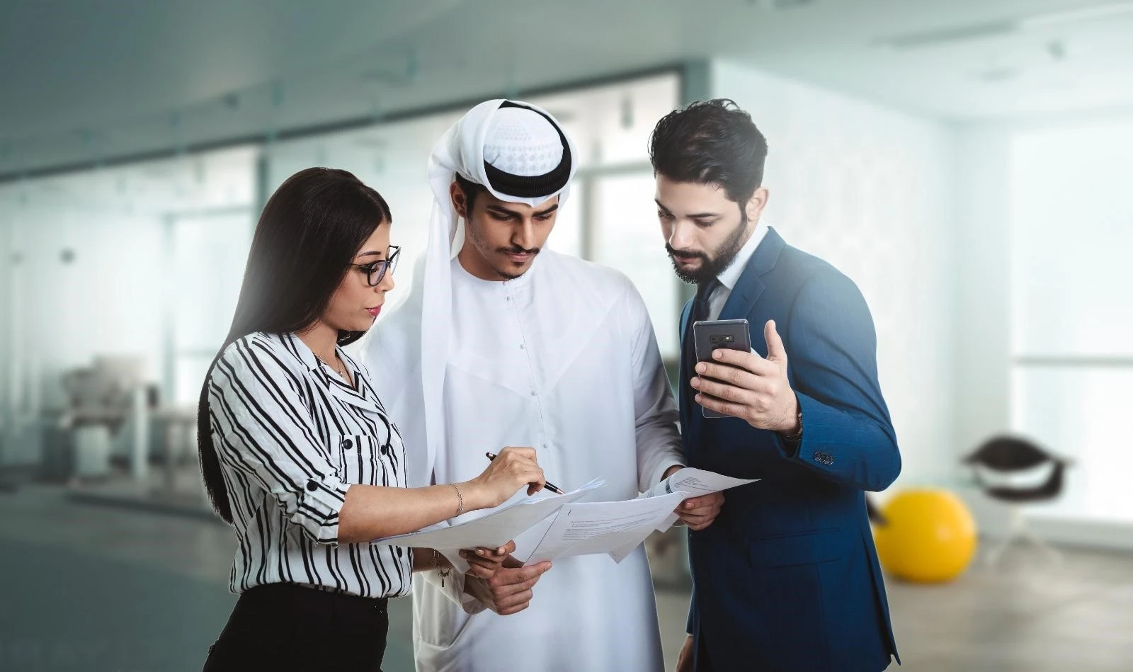 People working inside a modern office in Dubai