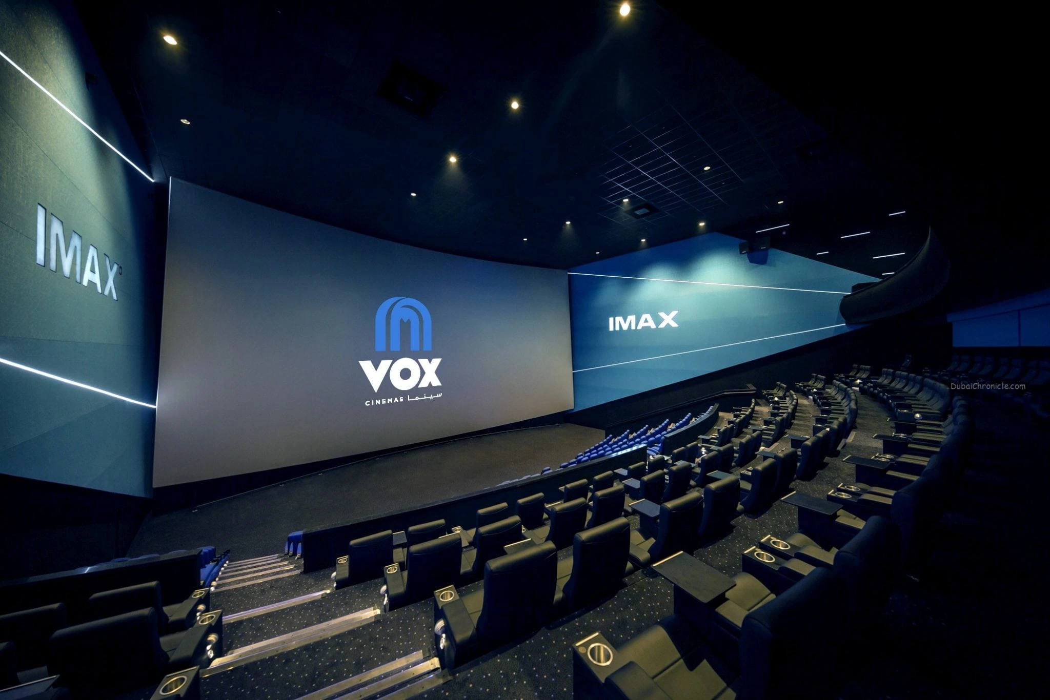 VOX cinema at Mall of the Emirates, Dubai, featuring a large screen and a light blue aesthetic interior.
