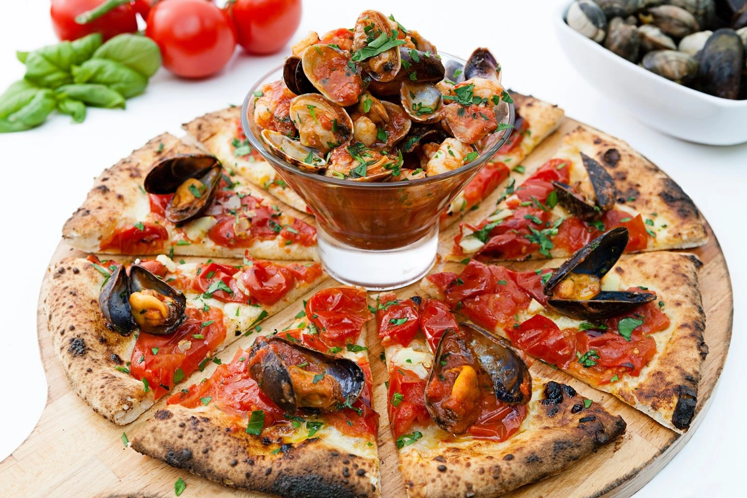 Freshly baked Italian pizza served at Luigia restaurant in Dubai with a golden-brown crust.