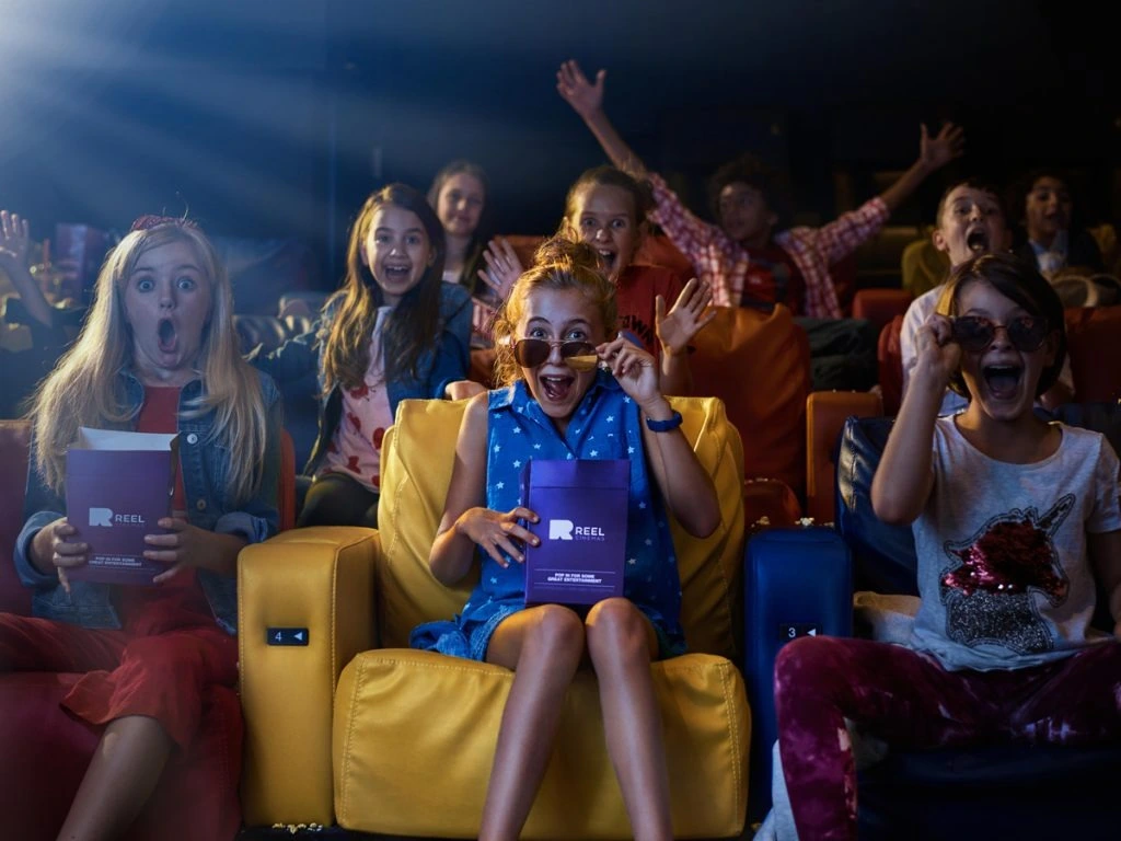 A family enjoying Dubai Summer Surprises at the cinema.