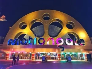 Motion gate entrance gate illuminates at night with colorful, vibrant lights