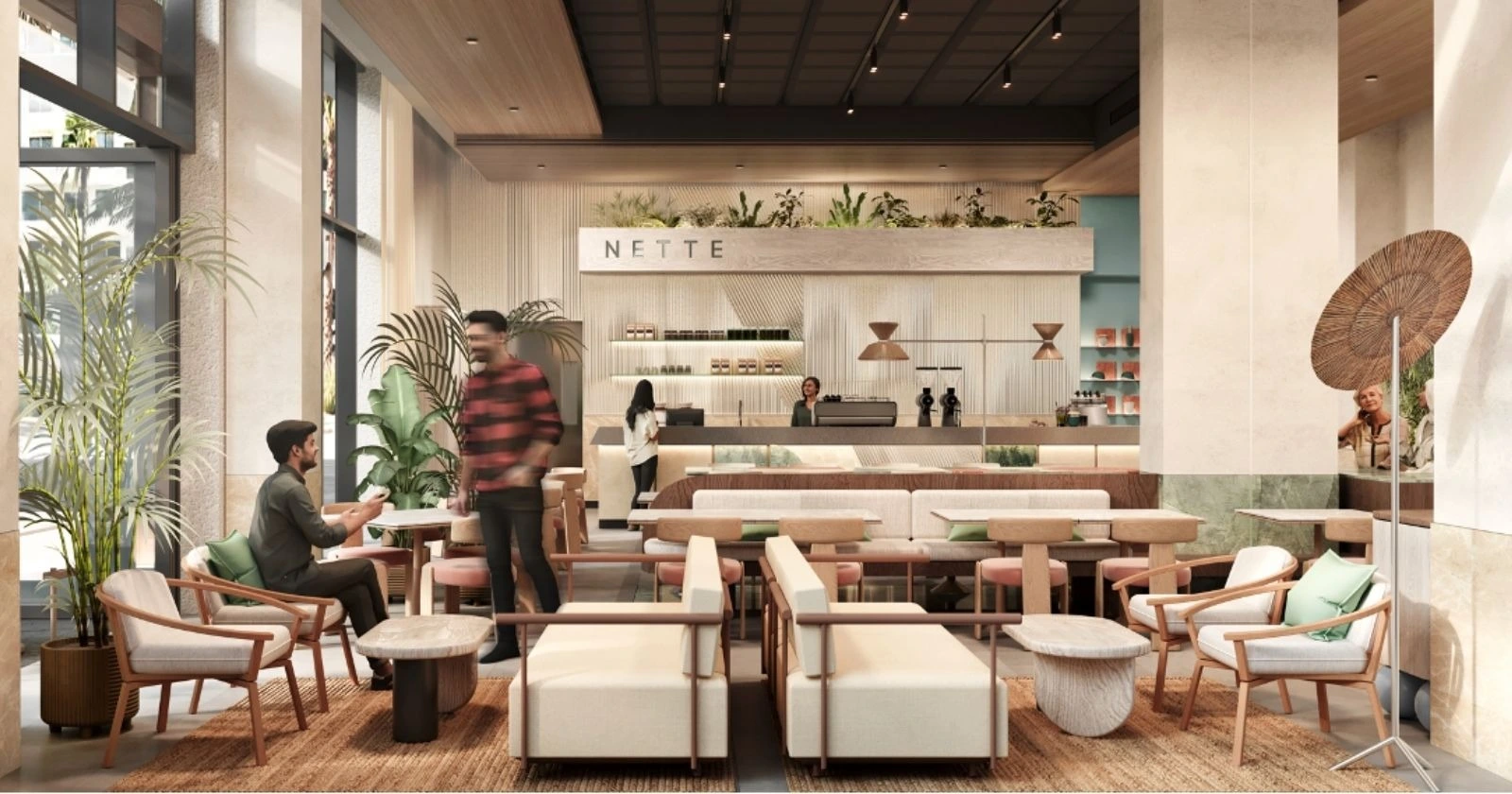 Interior of NETTE Café in Al Barari, Dubai, featuring modern minimalist design with cozy setting and indoor greenery.