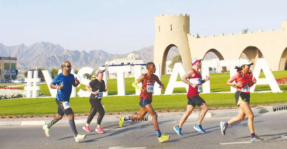 Runners at Hatta summer sports in front of Heritage fort.
