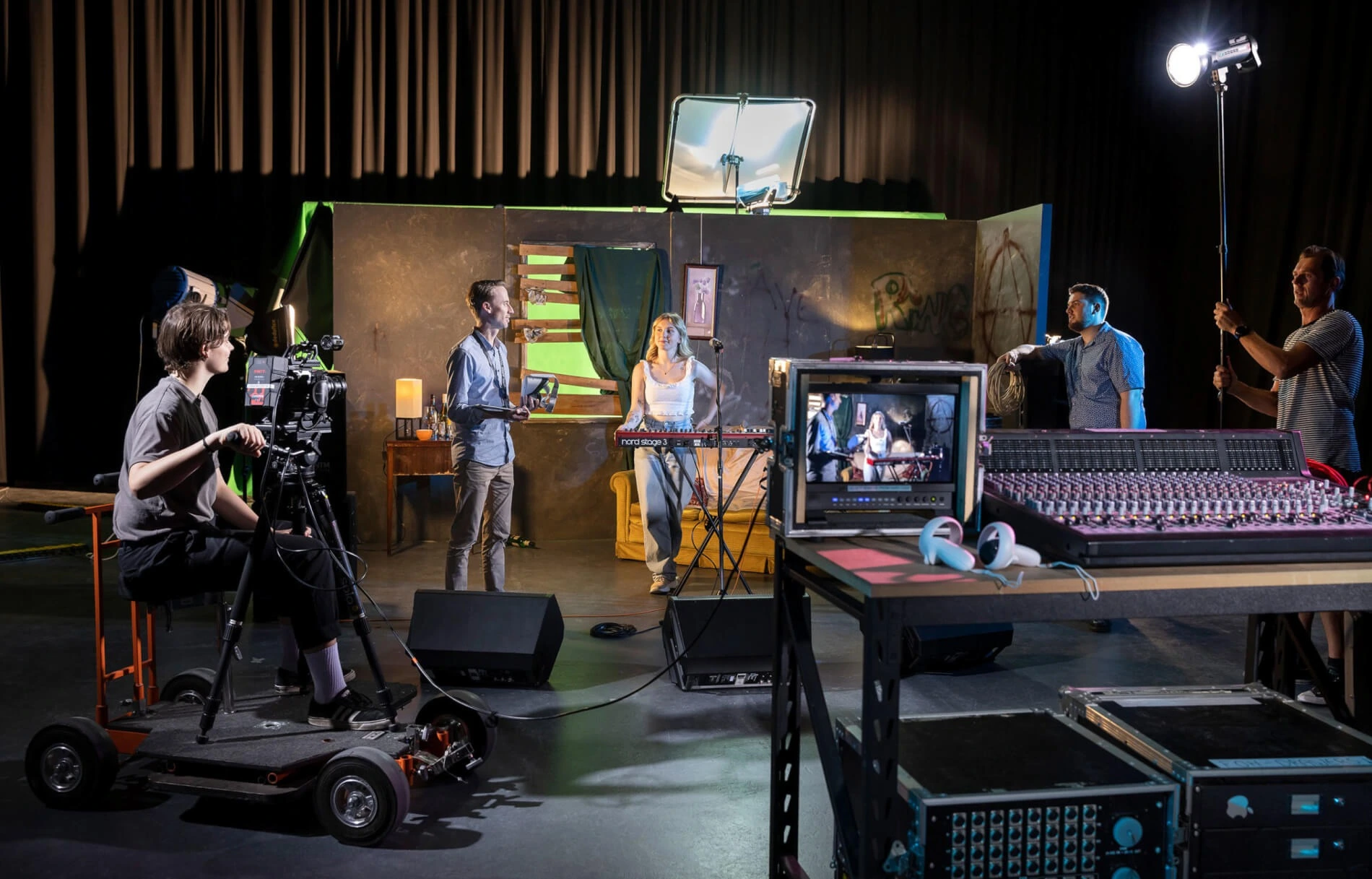 Teen students cooperating in a creative film studio setting