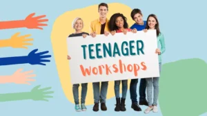 A group of teenagers carrying a poster that reads 'Teenager Workshops' with multicoloured adorned hands in the backdrop