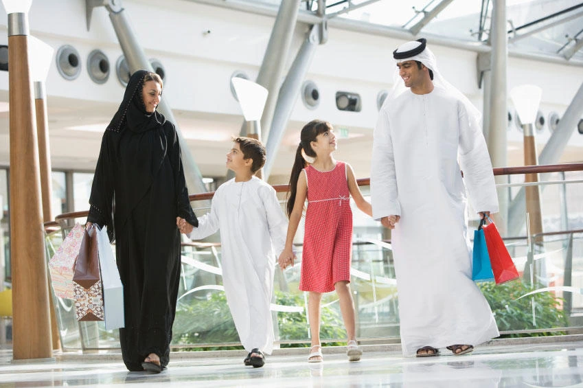An Emirati family shopping at a mall.