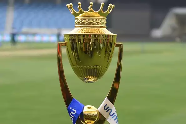 Asia Cup cricket trophy placed on a stadium field